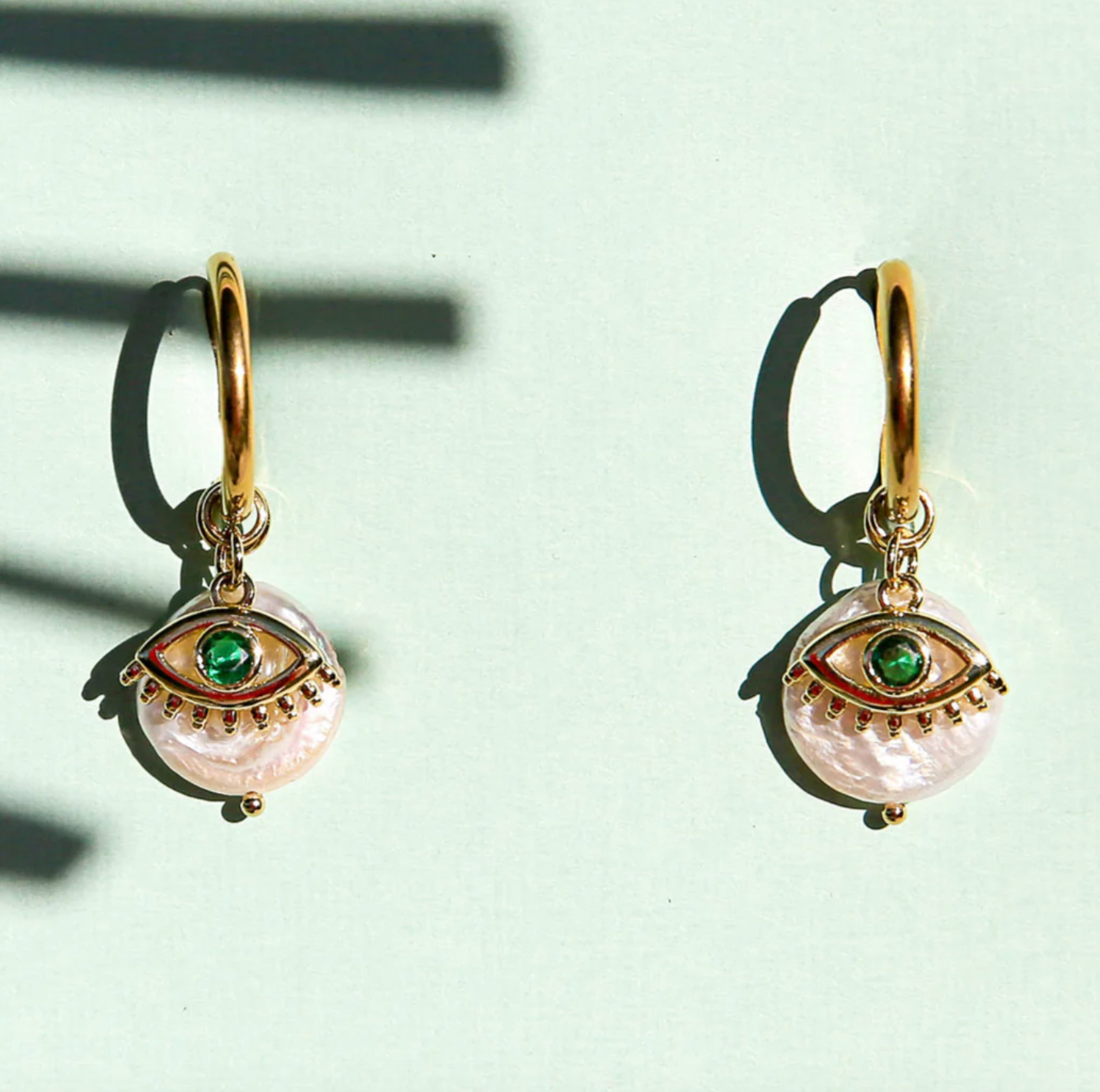 Green Eye Huggie Hoops